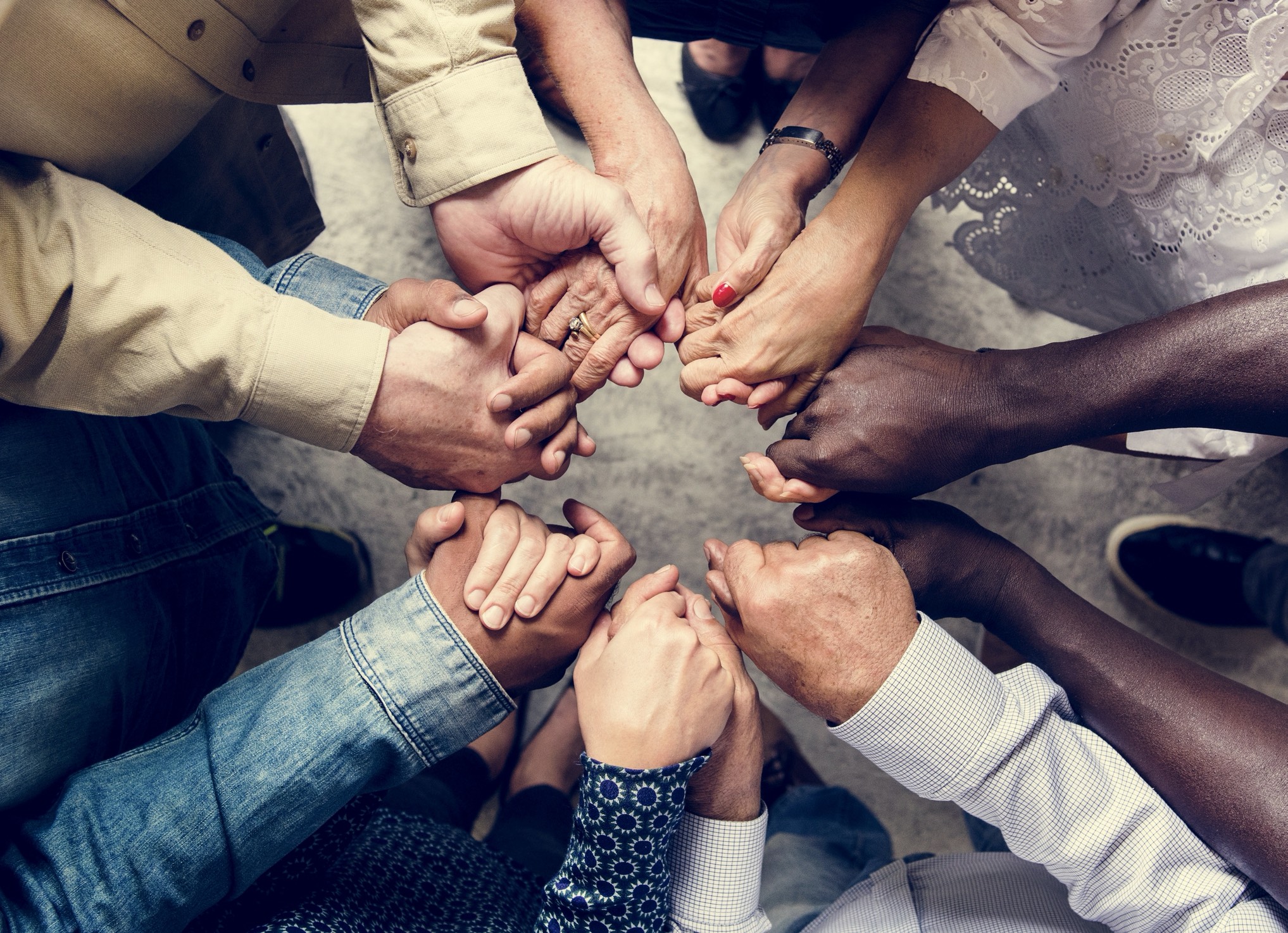 People holding hands in a circle