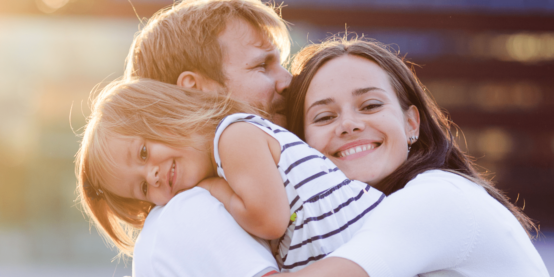 Parents and Child hugging