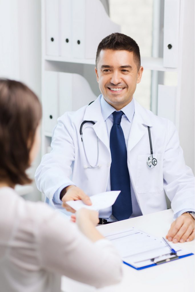 Doctor smiling while talking to patient